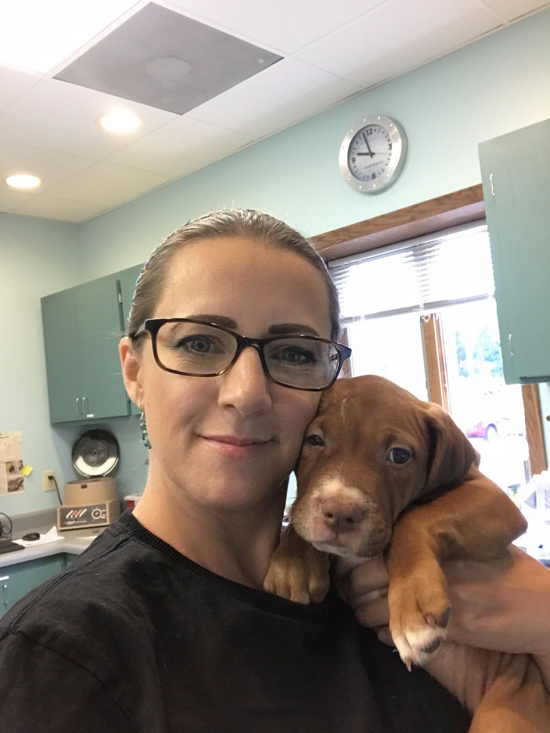 Mishicot Veterinary Clinic - Staff Member with Puppy